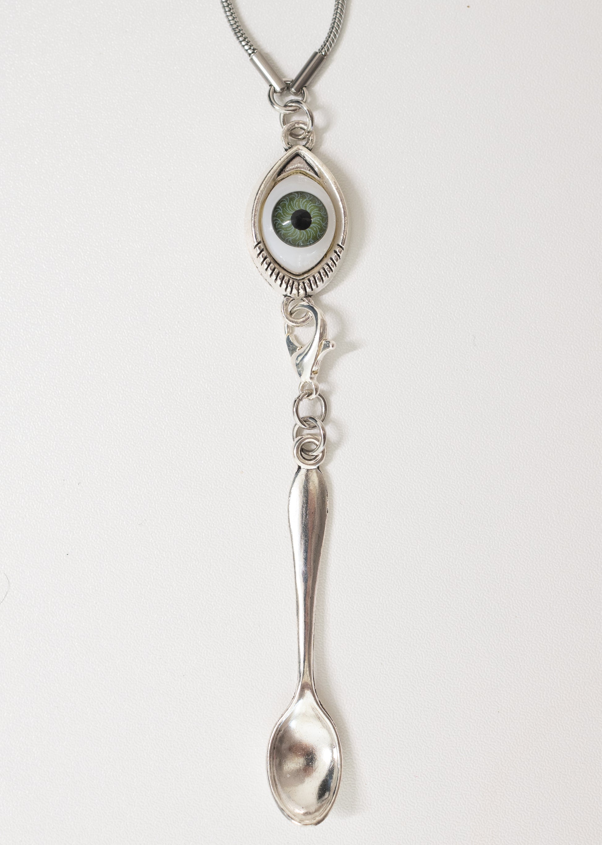 green evil eye spoon necklace