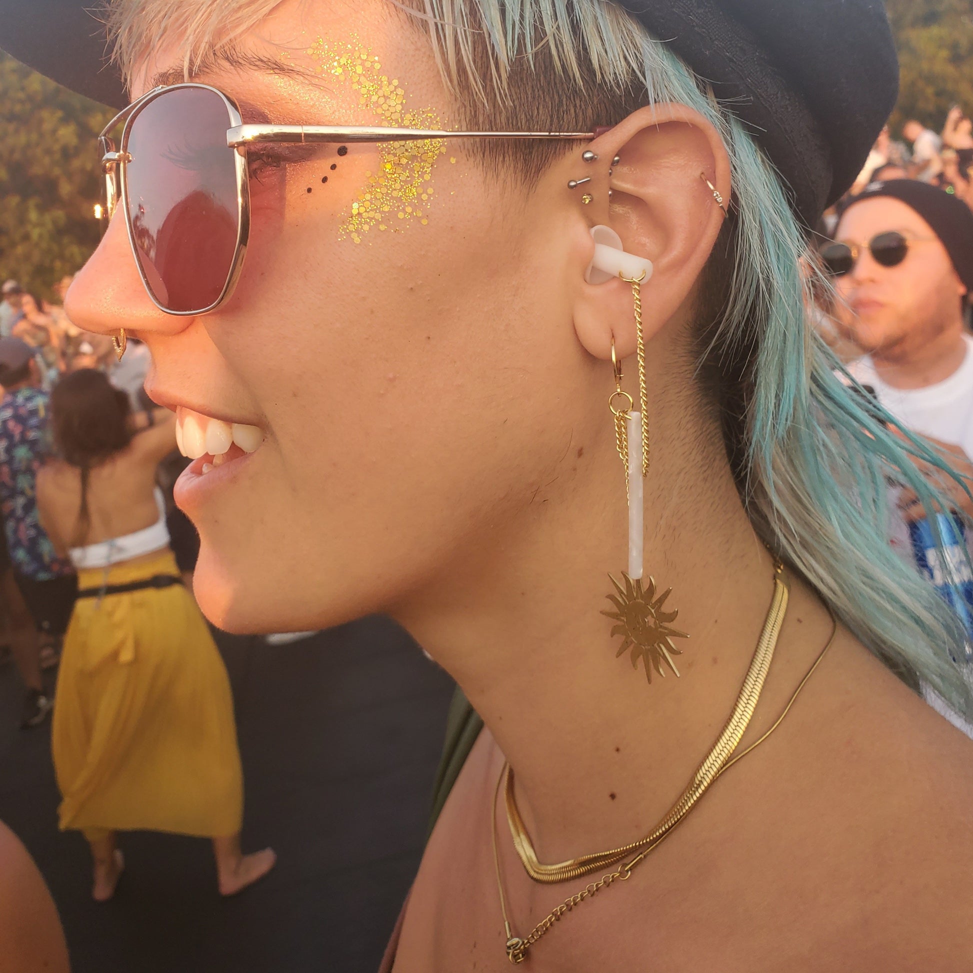 gold sun earplug earrings